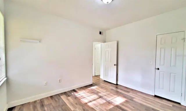 a bathroom with a sink toilet vanity and shower