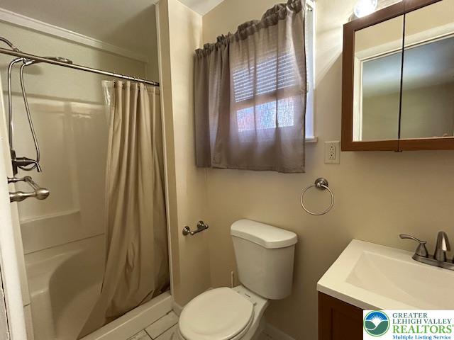 2065 Hopewell Road Bethlehem, PA 18017 - Photo 8 of 19 A bathroom with a combination shower and tub, offering practicality and efficiency.