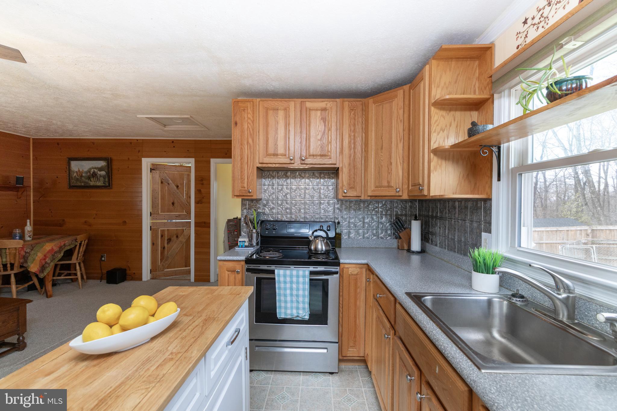 411 Mountain Lake Drive Front Royal, VA 22630 - Photo 13 of 38 a kitchen with a sink stove and cabinets