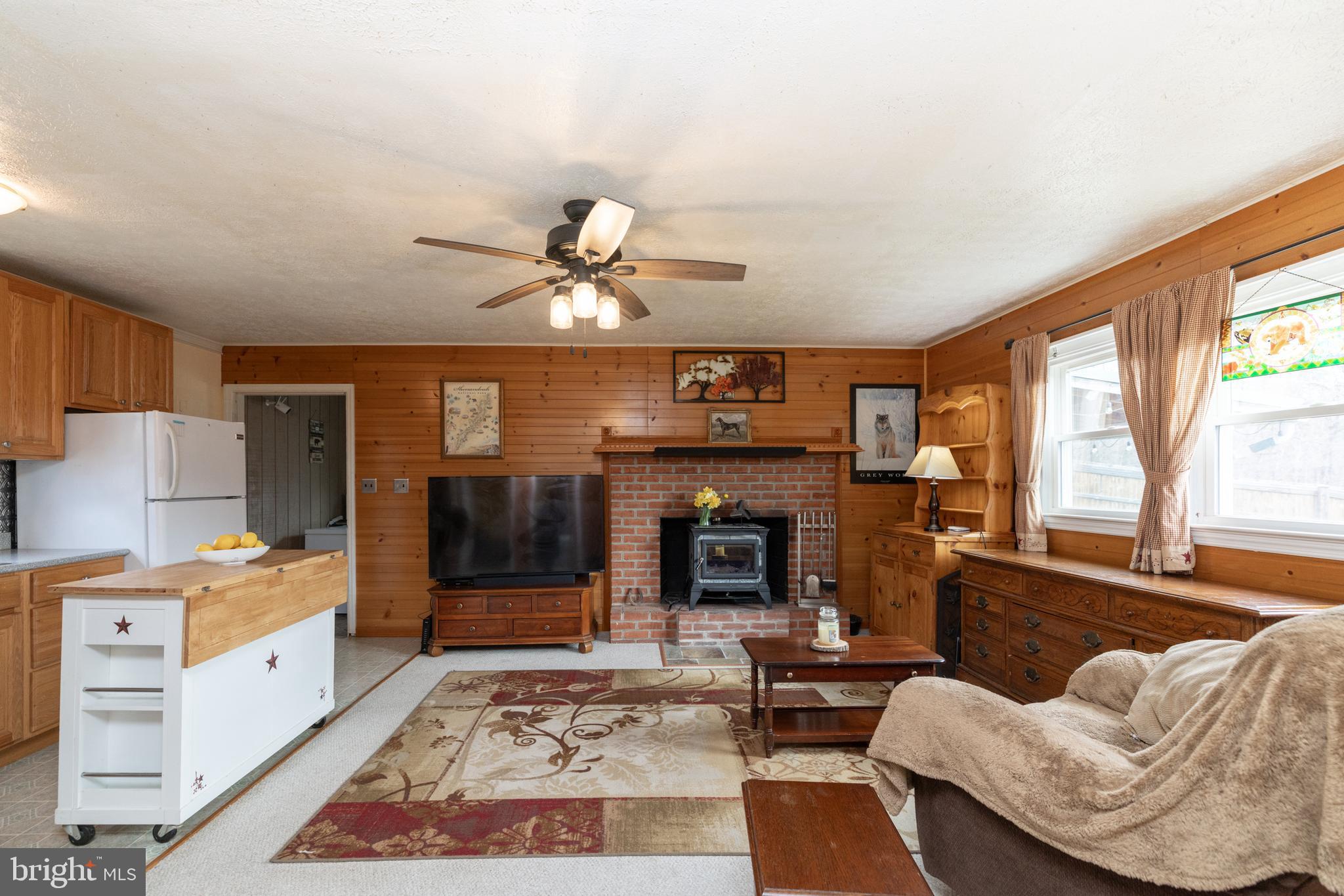 411 Mountain Lake Drive Front Royal, VA 22630 - Photo 17 of 38 a living room with furniture and a fireplace