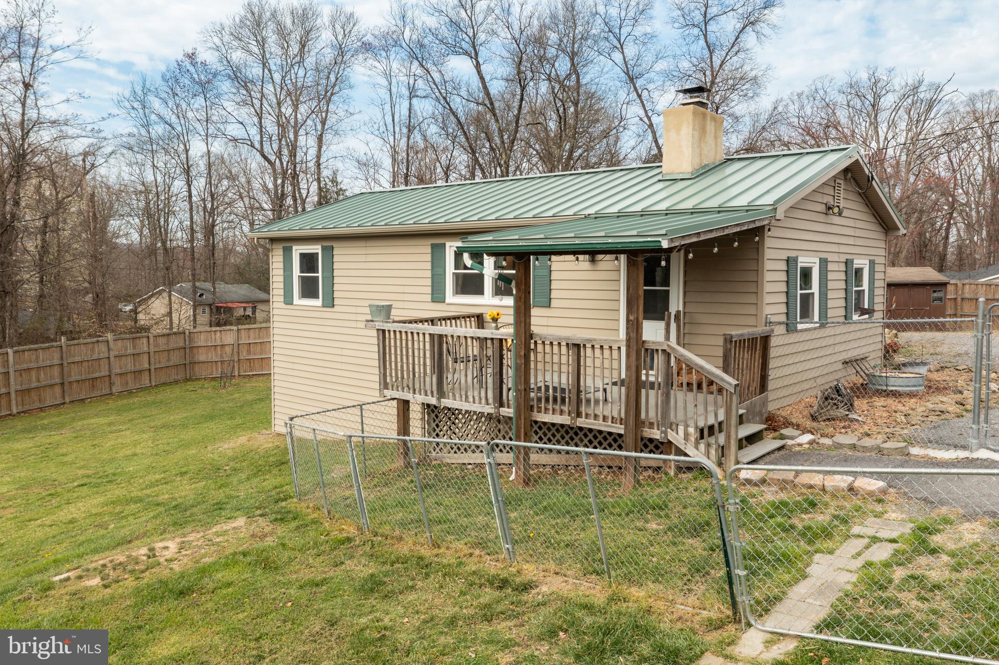 411 Mountain Lake Drive Front Royal, VA 22630 - Photo 2 of 38 a view of a house with backyard and sitting area