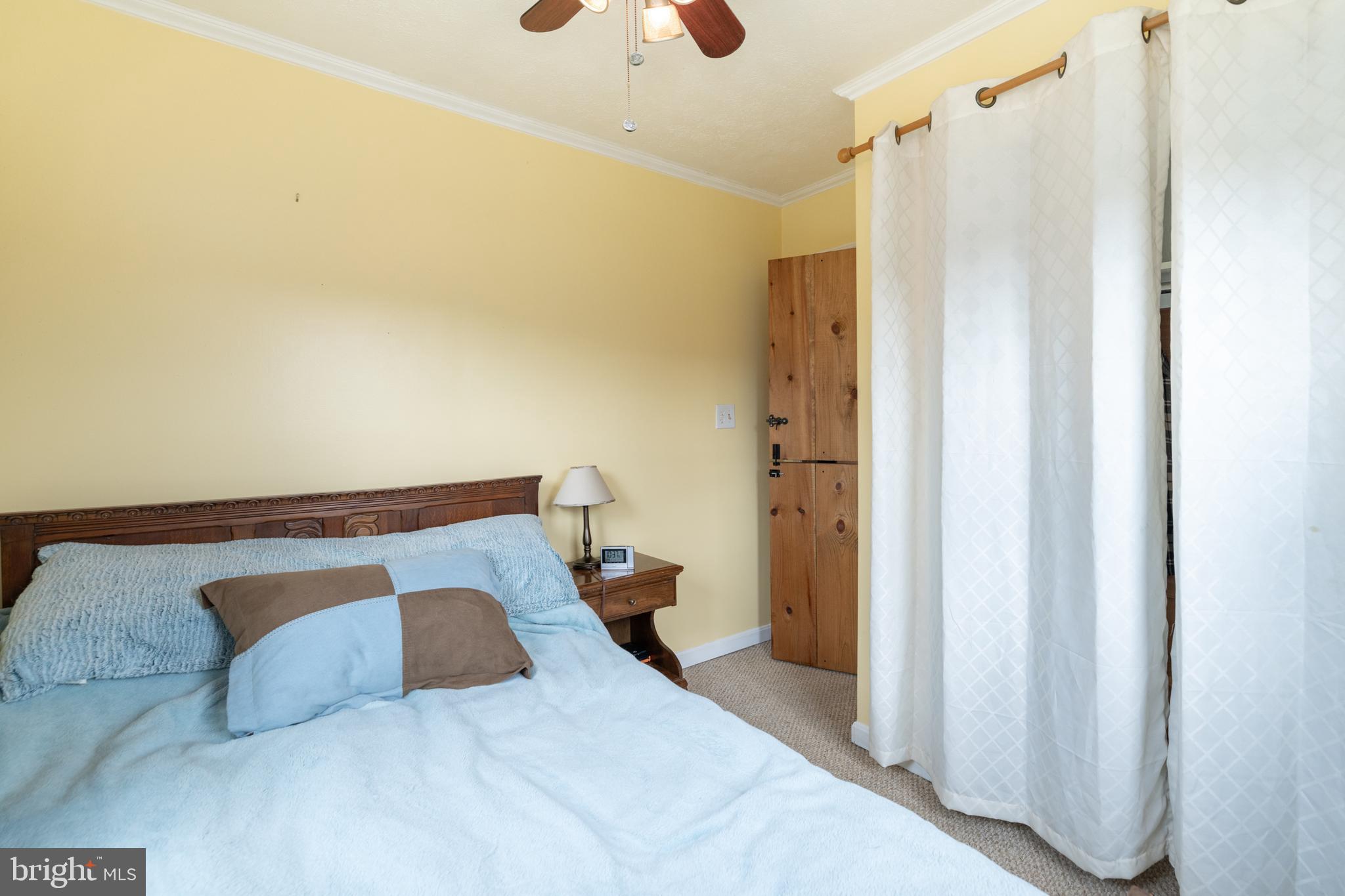 411 Mountain Lake Drive Front Royal, VA 22630 - Photo 21 of 38 a bedroom with a bed and a mirror