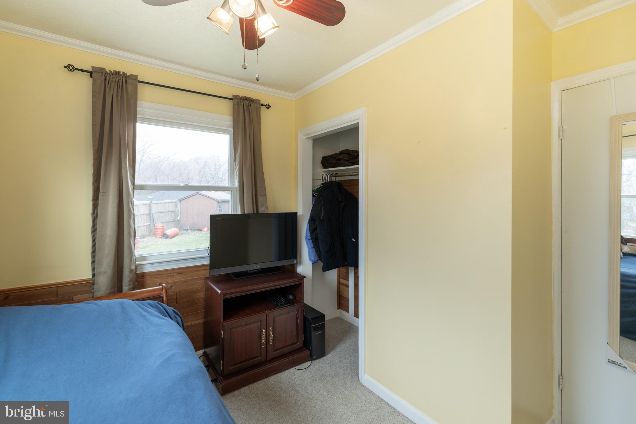 411 Mountain Lake Drive Front Royal, VA 22630 - Photo 23 of 38 a bedroom with a bed and wooden floor