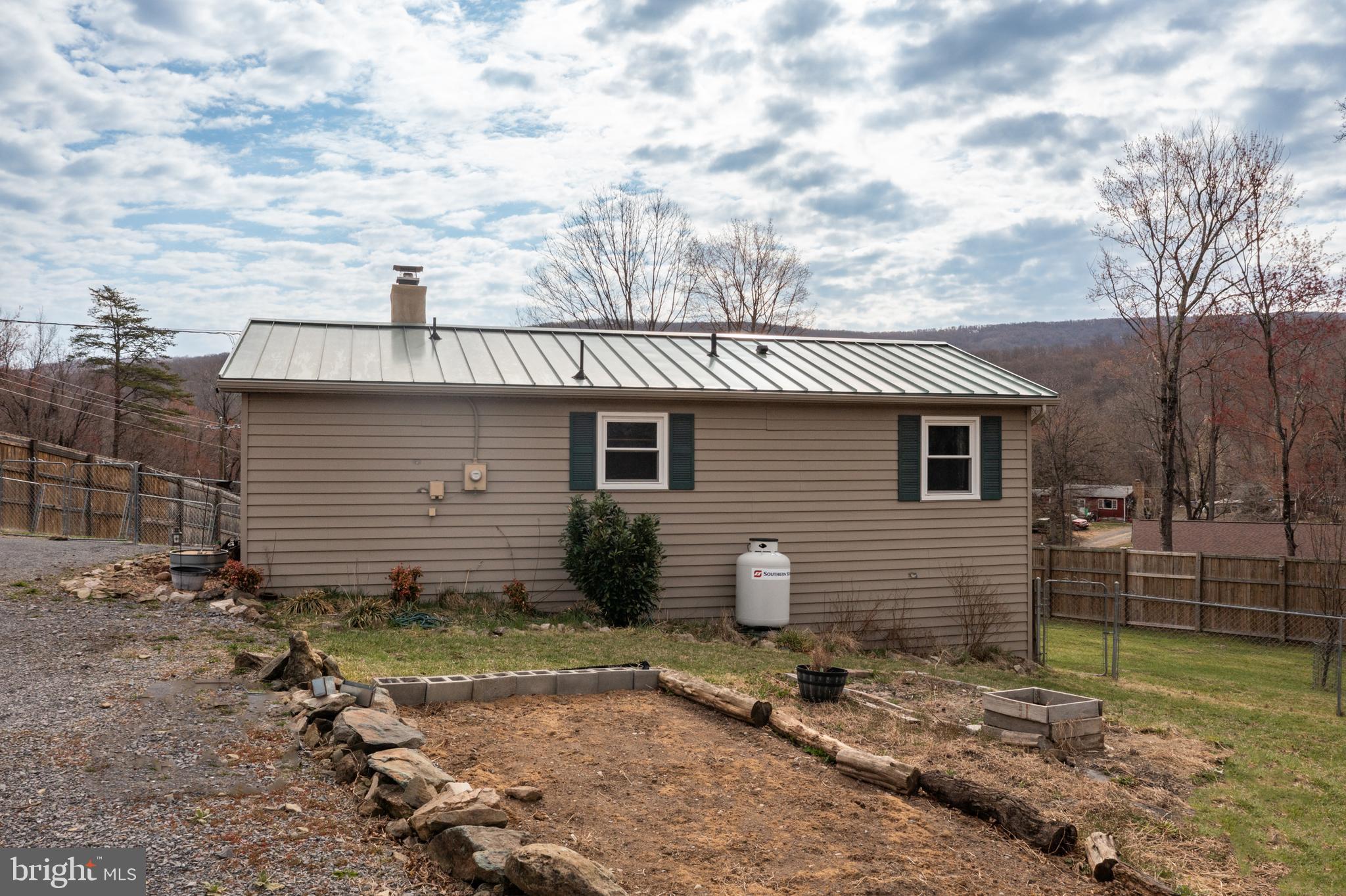 411 Mountain Lake Drive Front Royal, VA 22630 - Photo 27 of 38 a view of a house with backyard