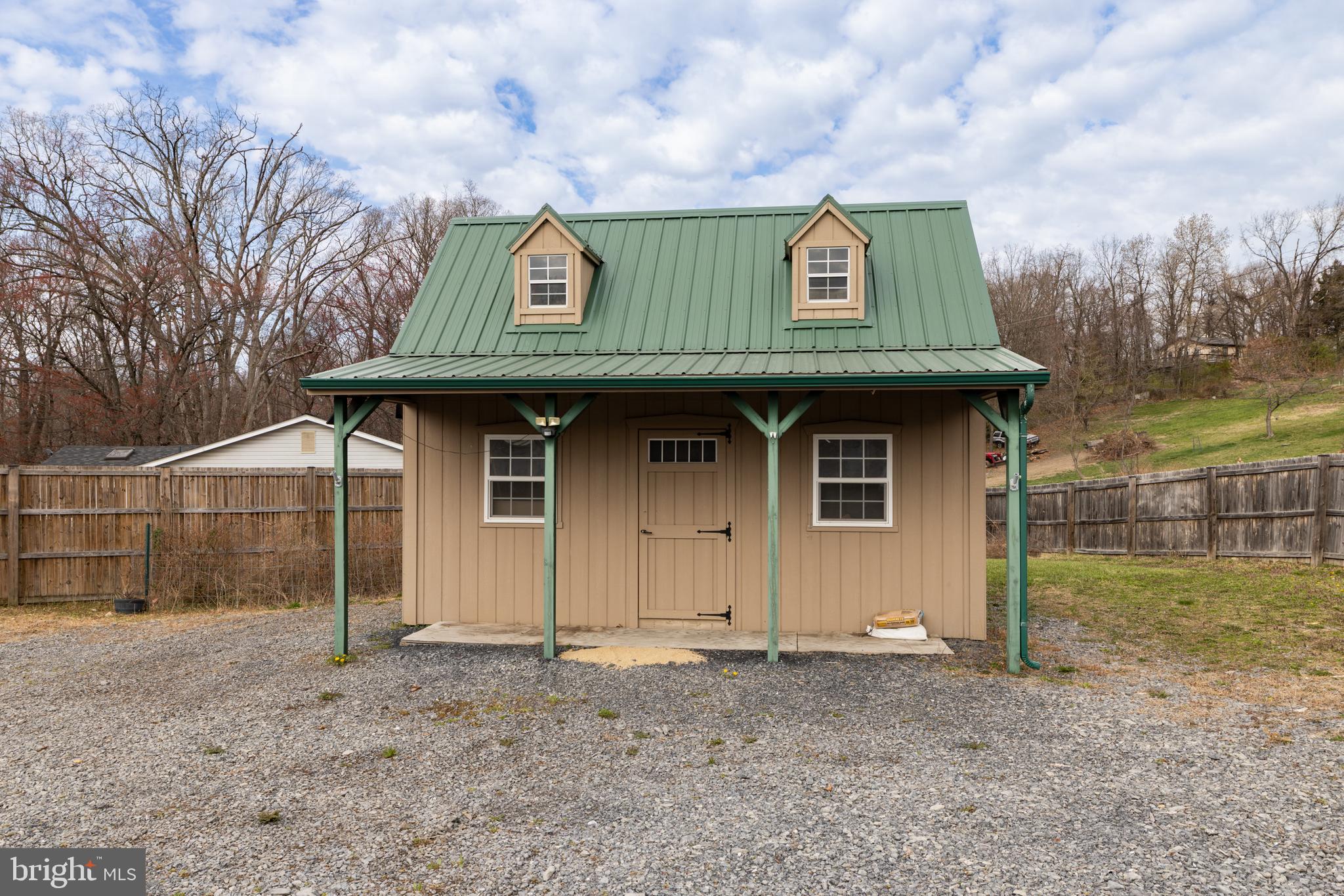 411 Mountain Lake Drive Front Royal, VA 22630 - Photo 29 of 38 a front view of a house with garden