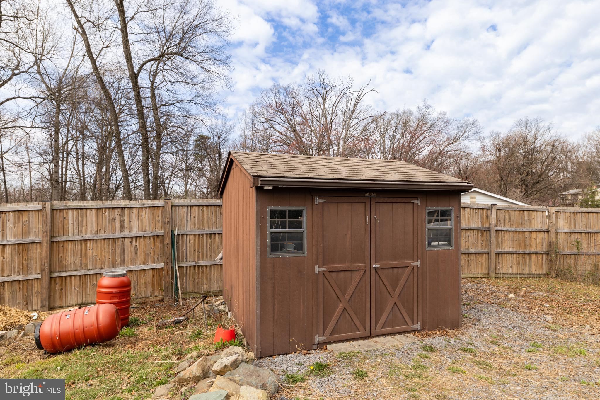 411 Mountain Lake Drive Front Royal, VA 22630 - Photo 32 of 38 a backyard of a house with sofas