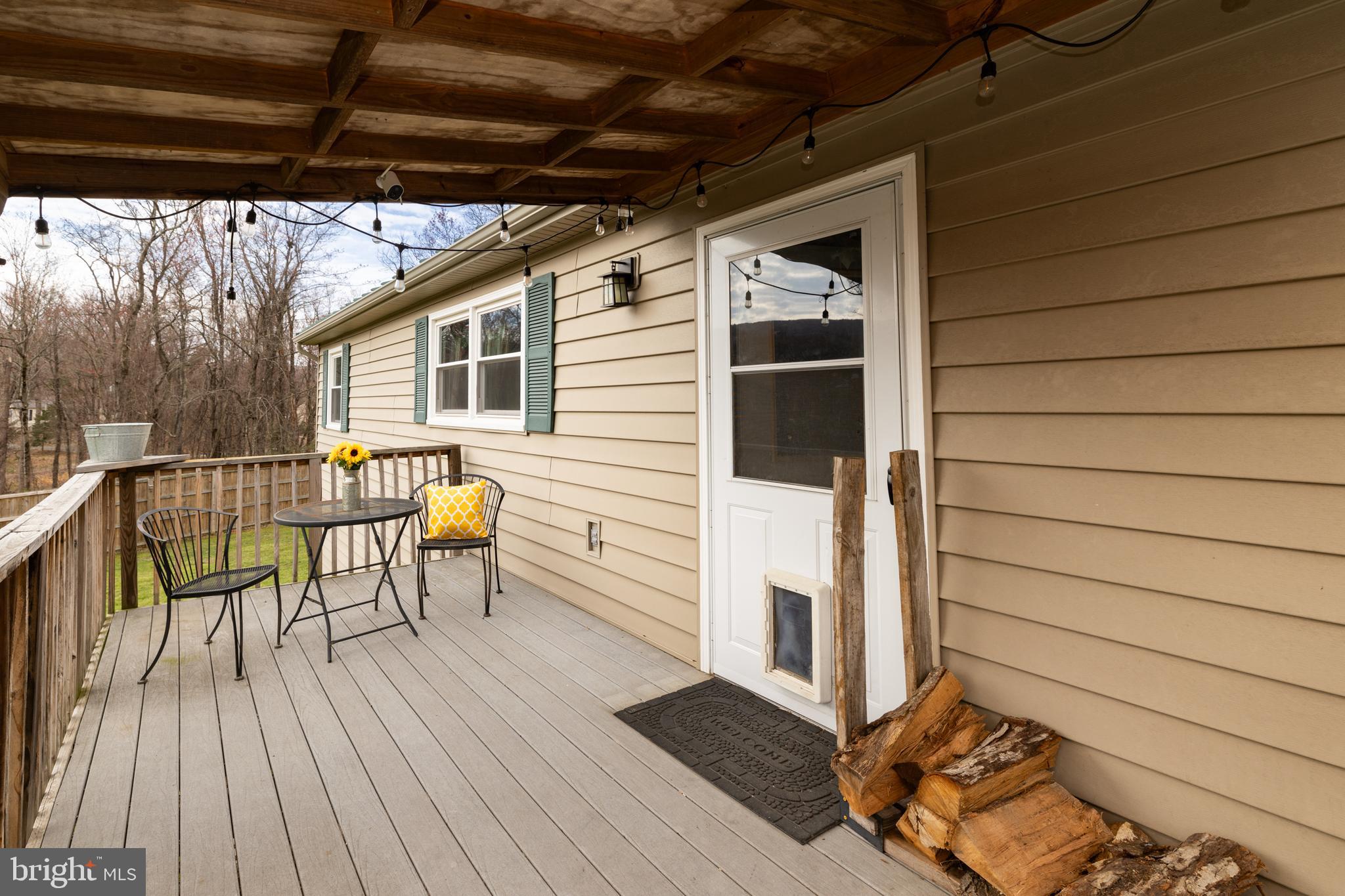 411 Mountain Lake Drive Front Royal, VA 22630 - Photo 6 of 38 a balcony with table and chairs