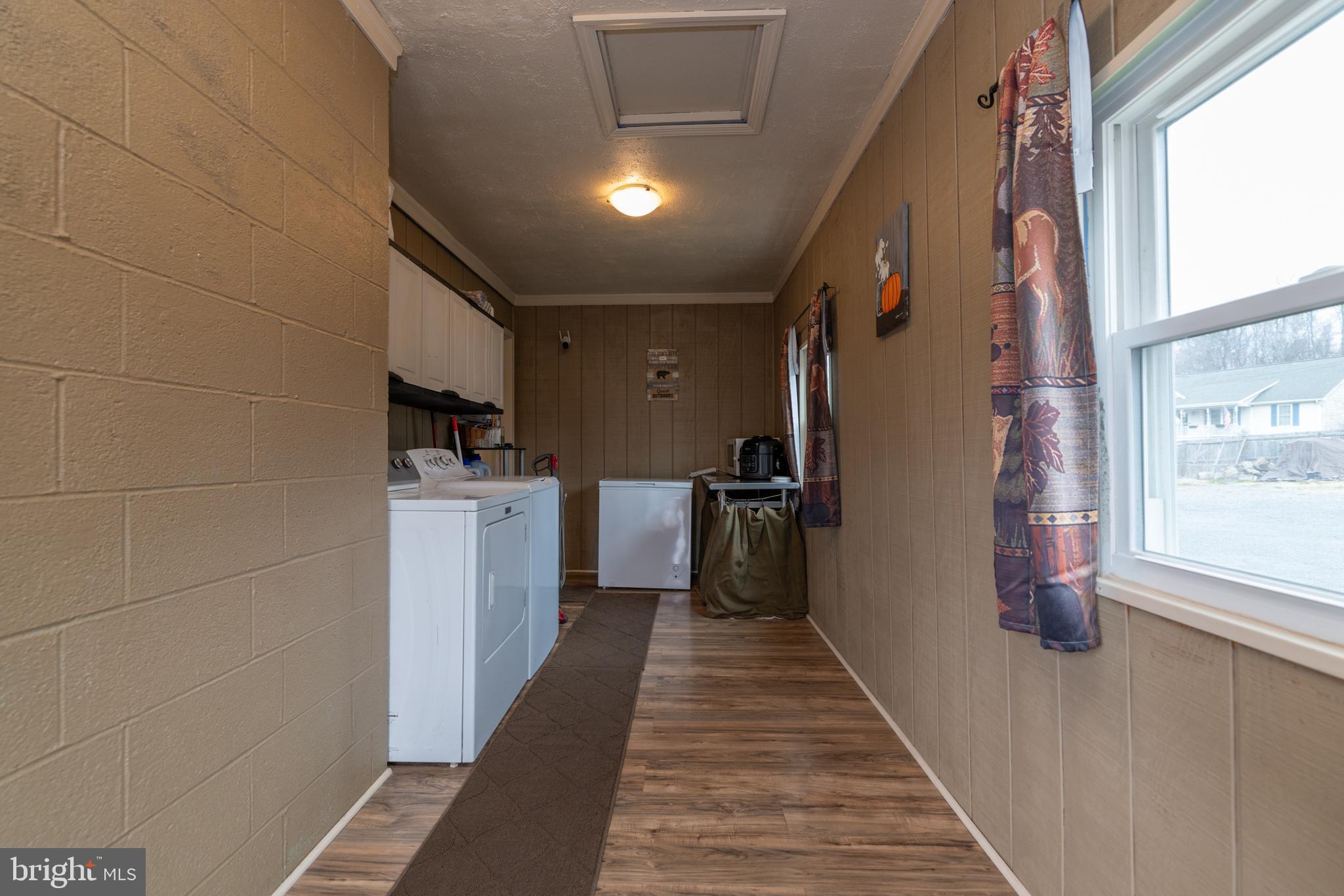 411 Mountain Lake Drive Front Royal, VA 22630 - Photo 10 of 38 a hallway with washer and dryer