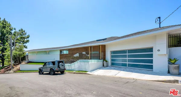 a view of a car garage with a couch