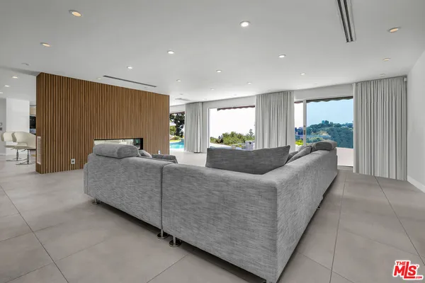 a living room with furniture and a rug