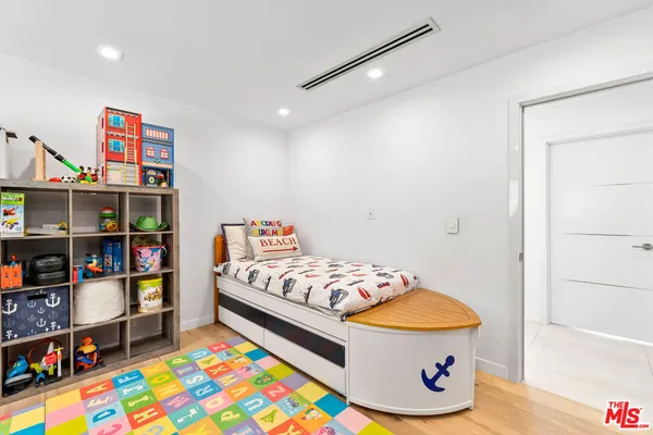 a bedroom with a bed and a walk in closet