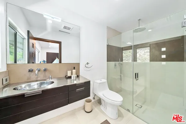 a view of a garden with a building in background