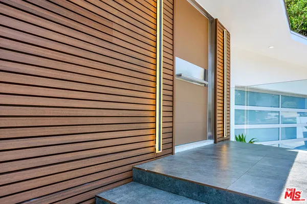 an outdoor space with wooden floor