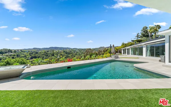 a view of an house with backyard space and garden