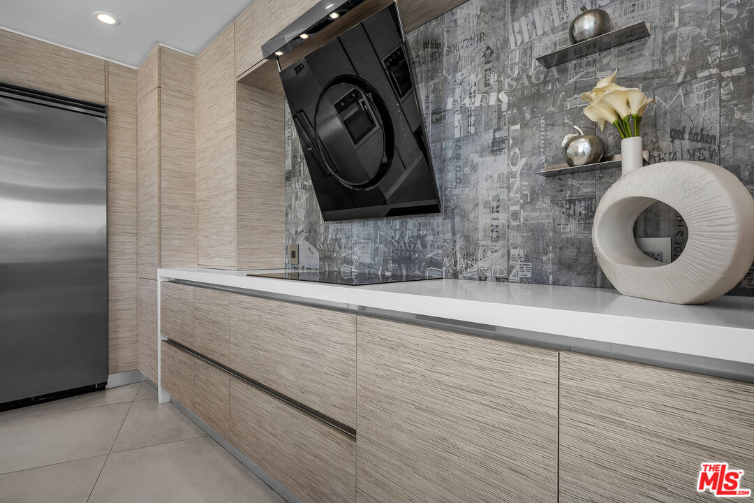 849 Glenmere Way Los Angeles, CA 90049 - Photo 10 of 40 a bathroom with a sink and a mirror