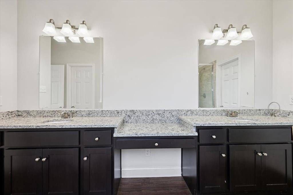 313 Marble Creek Drive Fort Worth, TX 76131 - Photo 18 of 27 a bathroom with a sink double vanity and a mirror