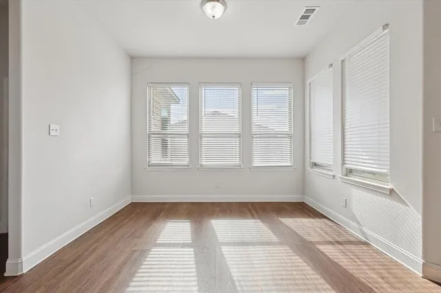 a view of empty room with ceiling fan