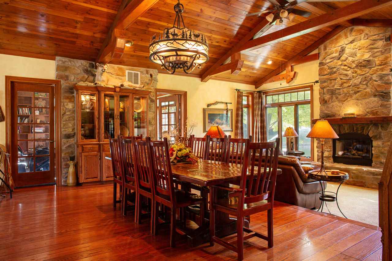 6820 West Spring Road Oregon, IL 61061 - Photo 7 of 24 a view of a dining room with furniture window and wooden floor