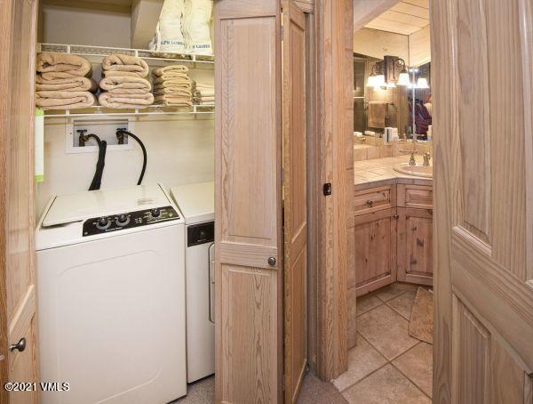 225 Wall Street, Unit 302 Vail, CO 81657 - Photo 17 of 19 a utility room with dryer and washer