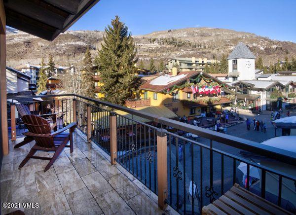 225 Wall Street, Unit 302 Vail, CO 81657 - Photo 5 of 19 a view of a balcony with wooden benches