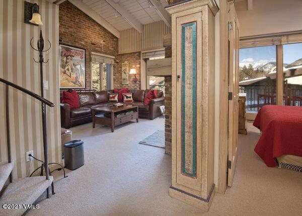 225 Wall Street, Unit 302 Vail, CO 81657 - Photo 9 of 19 a living room with furniture and a window