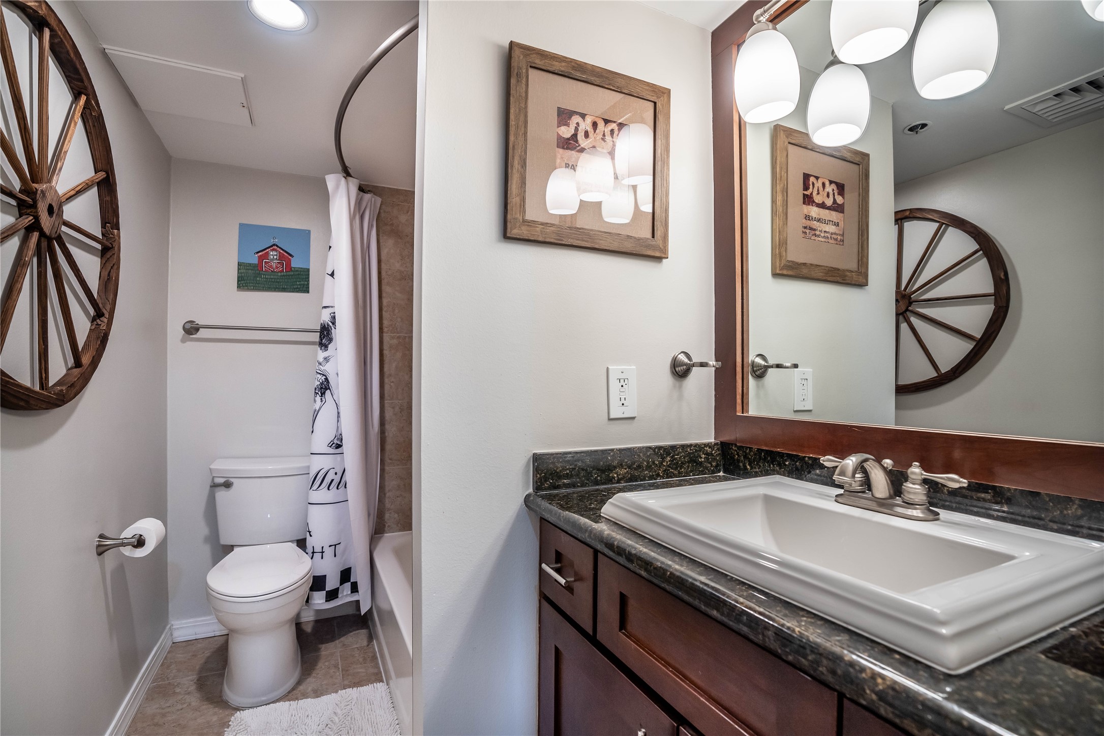 3525 Sage Road, Unit 1315 Houston, TX 77056 - Photo 13 of 20 a bathroom with a sink a toilet and a mirror
