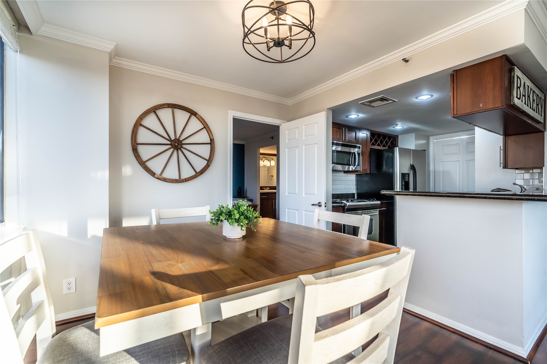 3525 Sage Road, Unit 1315 Houston, TX 77056 - Photo 5 of 20 a kitchen with stainless steel appliances granite countertop a sink a stove and a microwave