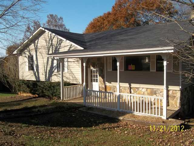 833 Bill Rutledge Road, Unit 1 Winder, GA 30680 - Photo 1 of 1 a view of a house with a small yard and wooden fence