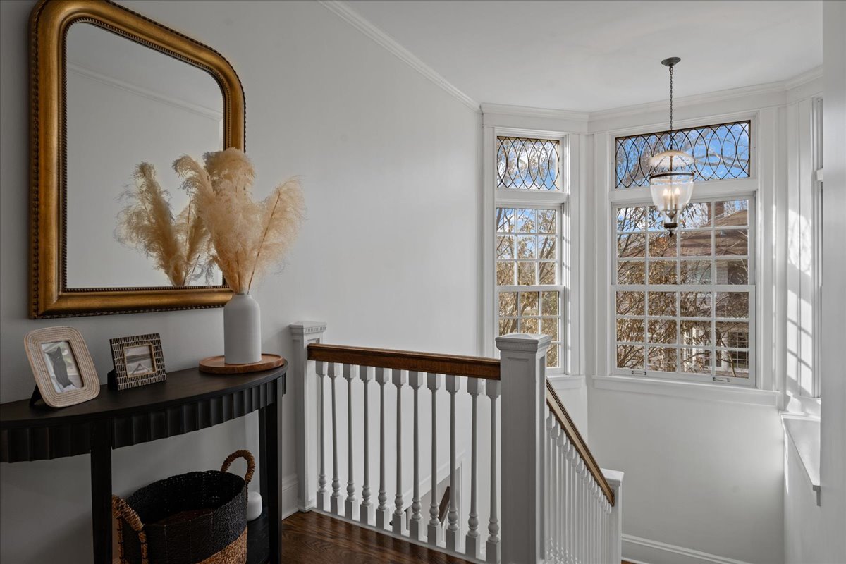 615 Abbotsford Road Kenilworth, IL 60043 - Photo 22 of 47 a view of a hallway with wooden floor and dining room