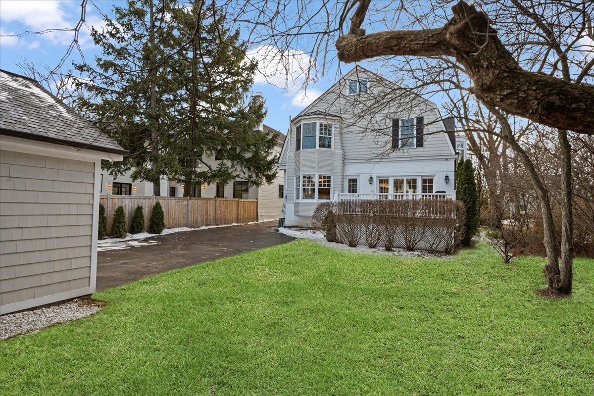 615 Abbotsford Road Kenilworth, IL 60043 - Photo 40 of 47 a view of a house with a yard and a patio