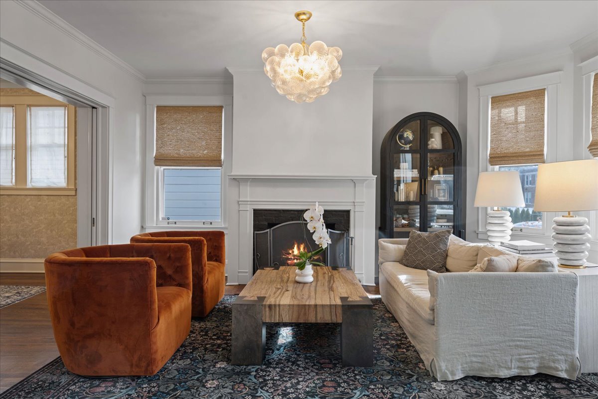 615 Abbotsford Road Kenilworth, IL 60043 - Photo 5 of 47 a living room with furniture a chandelier and a window