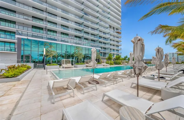 a view of a swimming pool with a patio