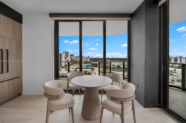 a view of a dining room with furniture window and outside view