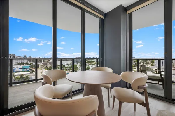 a view of a dining room with furniture window and outside view