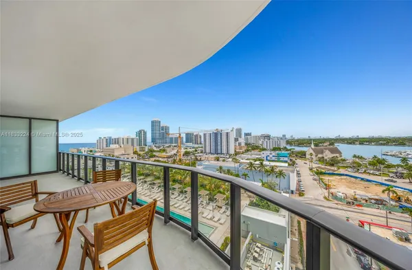 a view of a balcony with furniture