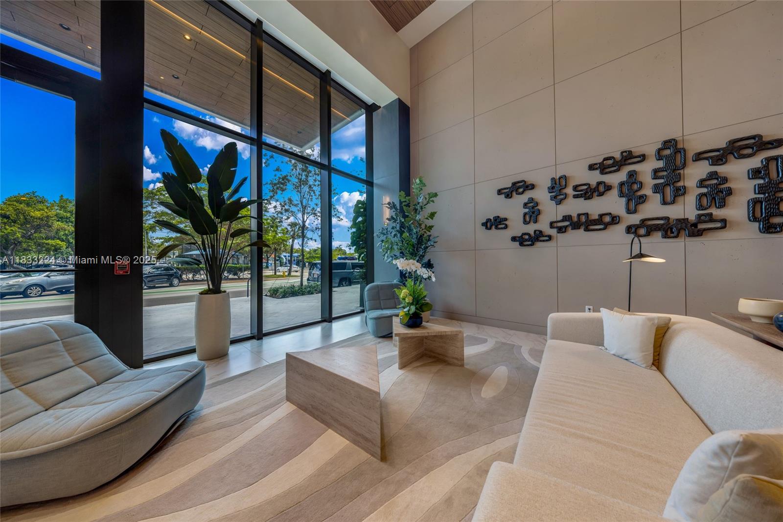 580 72nd Street, Unit 910 Miami Beach, FL 33141 - Photo 4 of 46 a living room with furniture and a large window