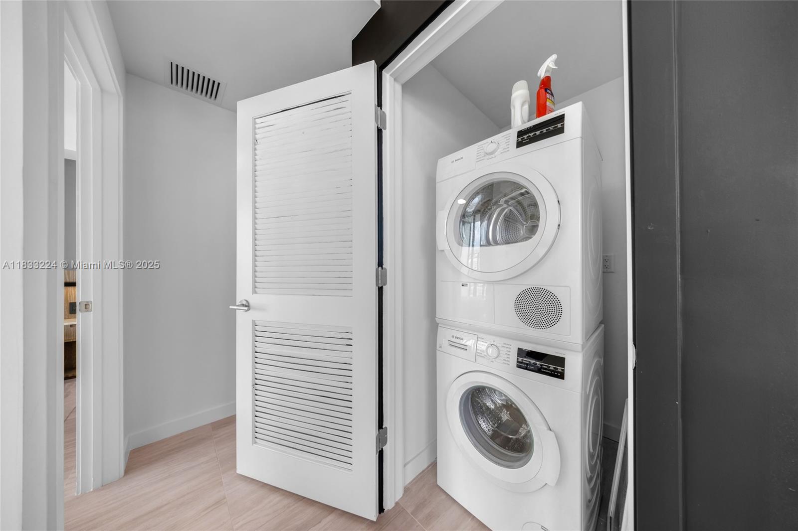 580 72nd Street, Unit 910 Miami Beach, FL 33141 - Photo 46 of 46 a utility room with dryer and washer