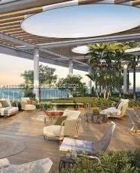 a view of a swimming pool with couches and lounge chairs