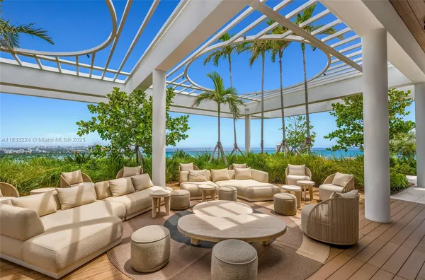 a view of a patio with couches and potted plants