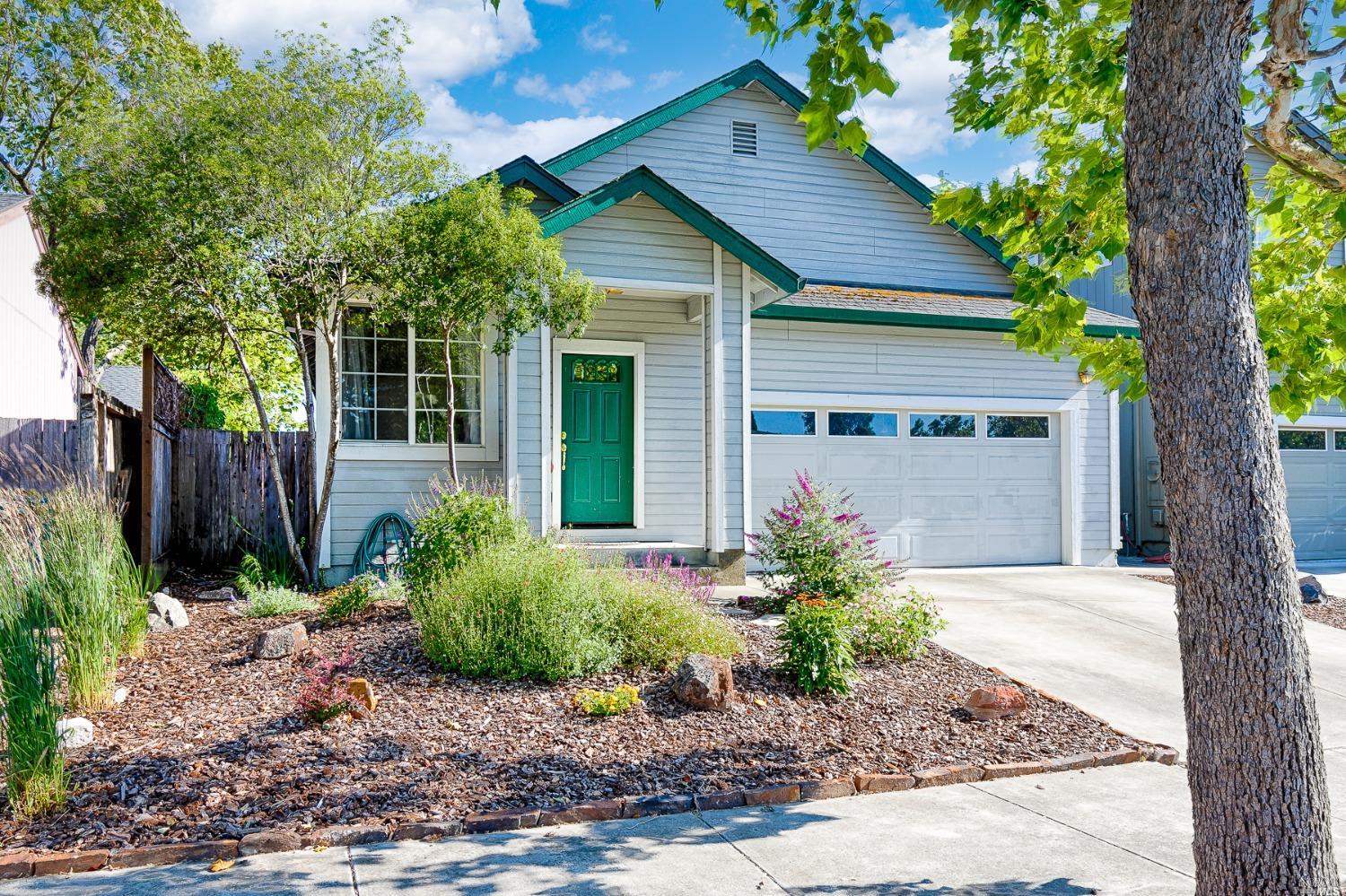 a house with a tree in front of it