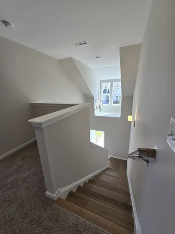 a view of an empty room with windows