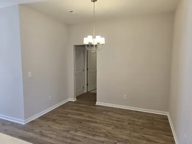 a view of a chandelier in an empty room
