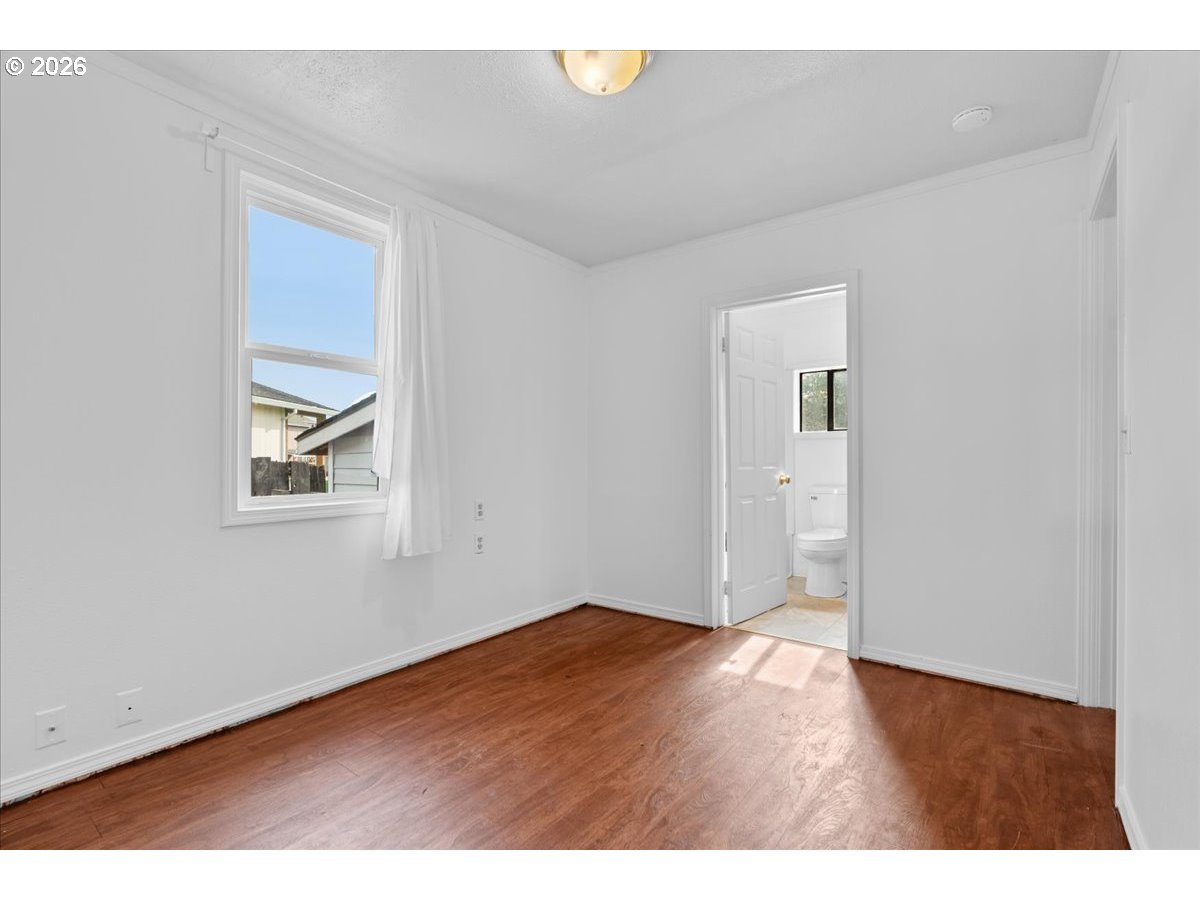 1070 Deer Island Road St. Helens, OR 97051 - Photo 20 of 34 a view of an empty room with wooden floor and a window