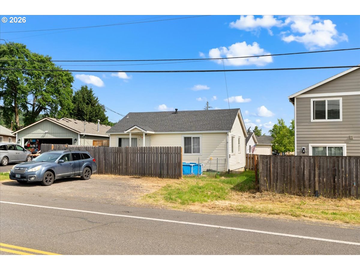1070 Deer Island Road St. Helens, OR 97051 - Photo 2 of 34 a view of a car parked in front of a house