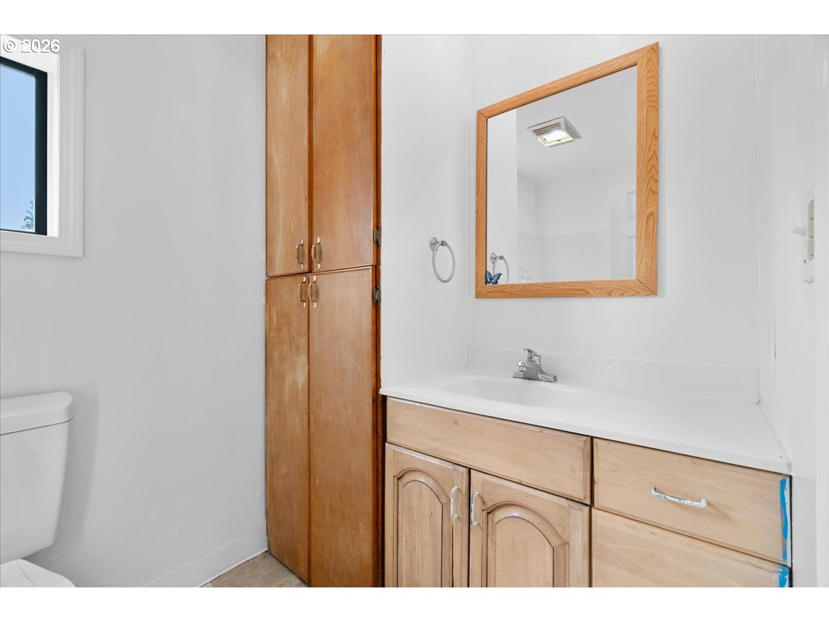 1070 Deer Island Road St. Helens, OR 97051 - Photo 21 of 34 a bathroom with a sink vanity and mirror