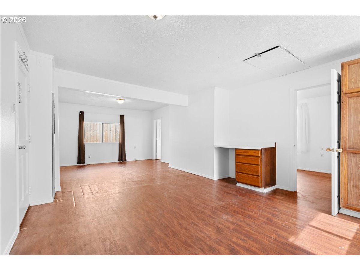 1070 Deer Island Road St. Helens, OR 97051 - Photo 10 of 34 a view of an empty room with wooden floor and a window
