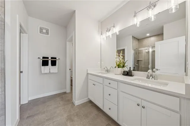 a bathroom with a double vanity sink mirror and double