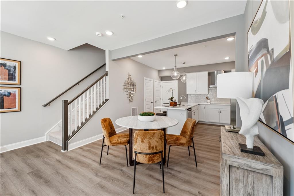 306 Skylar Court Southeast, Unit 89 Atlanta, GA 30312 - Photo 6 of 26 a view of a a dining room with furniture window and wooden floor