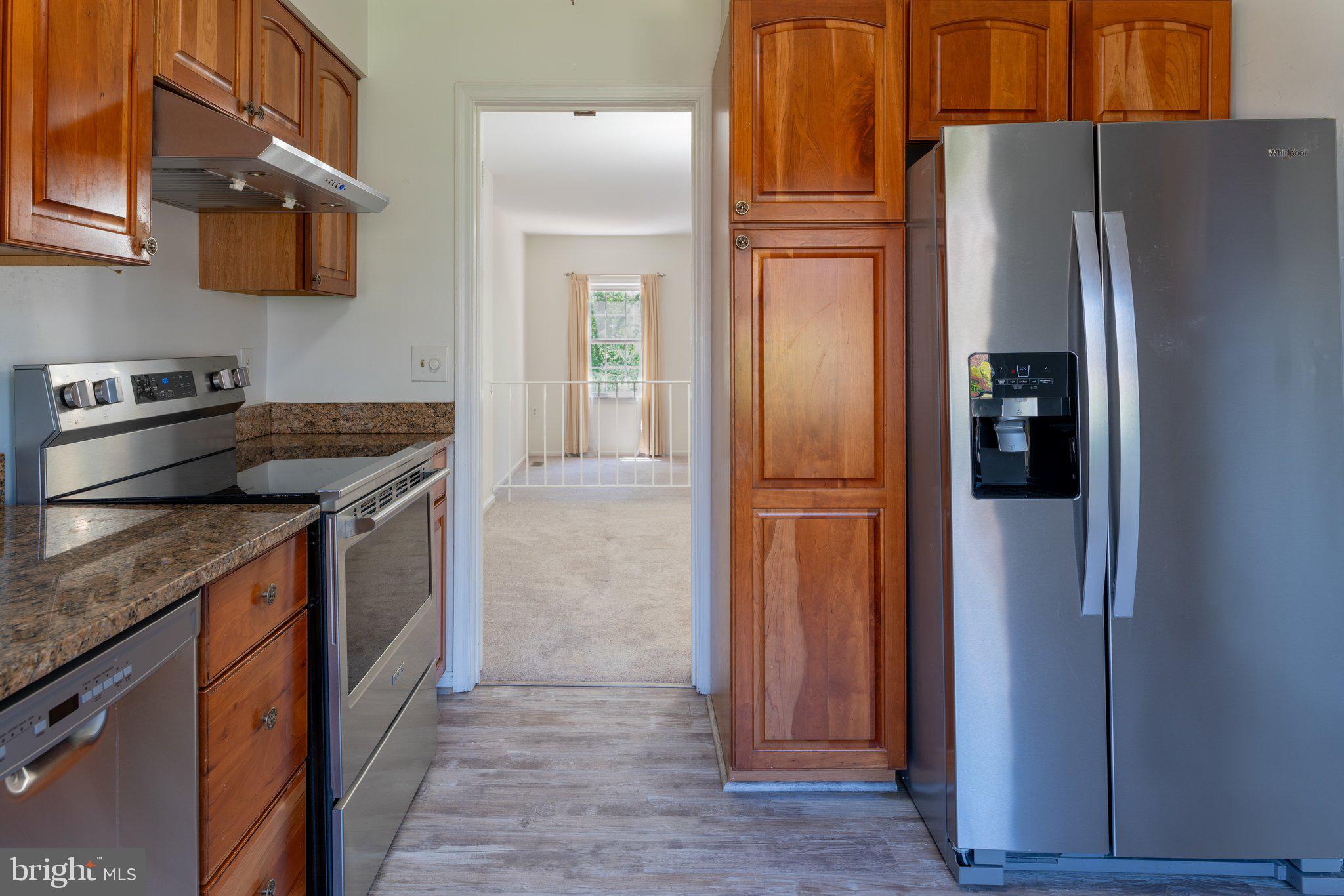 2913 Seminole Road Woodbridge, VA 22192 - Photo 13 of 34 a kitchen with stainless steel appliances granite countertop a refrigerator and a stove