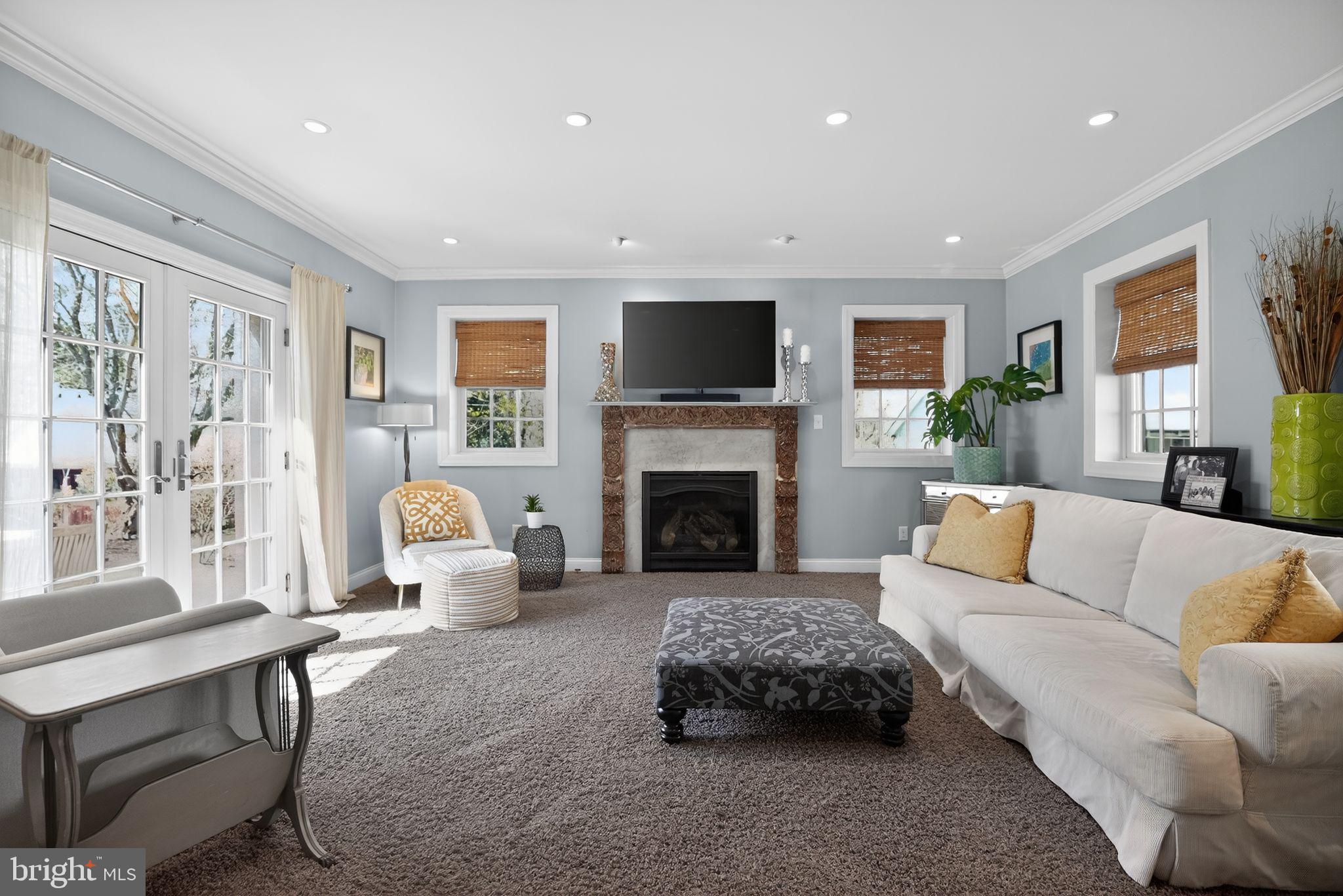 113 Waverly Road Wyncote, PA 19095 - Photo 12 of 38 Family room with fireplace and slider to patio